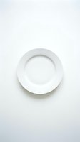 Empty white ceramic plate on clean white background isolated for kitchen and dining design projects.