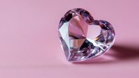 Crystal heart shape on pink background with soft shadow, romantic symbol of love and luxury jewelry design element for Valentine's Day and wedding themes.