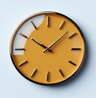 Modern minimalist wall clock with yellow face and black frame against light blue background, showing contemporary home decor style for office and living spaces.