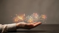Business professional hand presenting digital network connections with glowing nodes and data flow visualization for technology presentations.