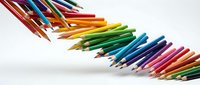 Sharpened colored pencils arranged in rainbow spectrum order on white background, suitable for art education, creative projects, and design resources.