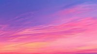 Vibrant sunset sky with dramatic wispy clouds in pink, purple and orange hues creating ethereal atmospheric backdrop for nature and landscape designs.