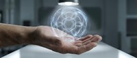 Male hands holding glowing holographic sphere with geometric patterns in modern office environment for technology and innovation concepts.
