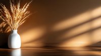 Golden wheat stalks in white ceramic vase on wooden surface with warm sunlight and shadow patterns creating cozy autumn home decor atmosphere.