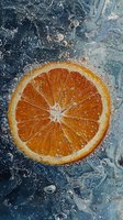 Fresh orange slice splashing in clear water with bubbles and droplets against blue background, creating dynamic motion and refreshing atmosphere.