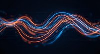Abstract flowing light trails in orange and blue colors creating dynamic wave patterns on dark background for modern digital design projects.