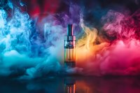 Electronic cigarette device surrounded by vibrant colorful vapor clouds in blue, yellow and pink, reflecting on dark glossy surface against black background.