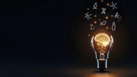 Glowing light bulb with brain filament and floating science icons on dark background representing innovation, creativity and scientific breakthrough concepts.