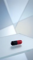 Single red and black pharmaceutical capsule on white surface with soft geometric shadows and modern minimalist lighting for medical concepts.