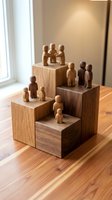 Wooden figurines arranged on stepped blocks representing hierarchy, teamwork and organizational structure in warm natural lighting for business concepts.