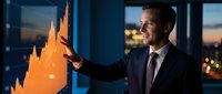 Professional businessman analyzing financial growth chart on digital display in modern office environment during evening hours.