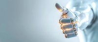Robotic hand showing thumbs up gesture against blurred light background, representing artificial intelligence and future technology advancement.