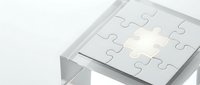 Glass cube with puzzle pieces on top, one glowing piece highlighting a missing solution concept for business and strategy.