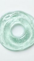 Transparent mint green gel or silicone ring with water droplets, isolated on white background. Suitable for skincare, wellness, beauty product design, and cosmetic packaging mockups.