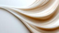 Smooth flowing cream silk fabric waves with elegant curves and soft shadows on white background for luxury textile design and fashion projects.
