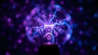 Electric plasma ball with purple and blue lightning bolts creating magical energy patterns against dark background for science and technology concepts.