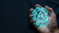 Glowing cyan letter A symbol with geometric neon lines held in hand against dark background, representing technology, innovation, artificial intelligence, and digital transformation concepts.