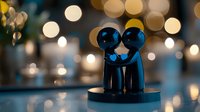 Minimalist ceramic couple figurines embracing on dark background with soft bokeh lights creating romantic atmosphere. Love and togetherness concept.