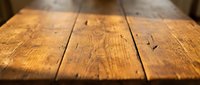 Empty wooden table surface with natural grain texture and rustic planks for product display and food photography backgrounds.