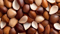 Fresh raw hazelnuts background with whole and halved nuts showing cream colored interior and brown shells in macro close up view for food design.