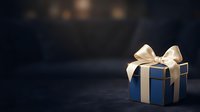 Blue gift box with gold ribbon bow on dark background with bokeh lights, suitable for holiday, celebration, and promotional designs.