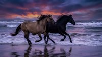 Two wild horses galloping along ocean shore at sunset with dramatic purple and pink sky reflecting in wet sand creating romantic equine scene.