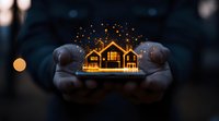 Glowing miniature house model held in hands with magical sparkles rising against dark background, creating dreamy real estate concept for property marketing.
