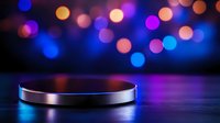 Metallic cylindrical platform stage with colorful bokeh lights background for product display and presentation in modern studio setting.