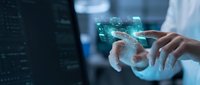 Professional using holographic digital interface technology with glowing data visualization and futuristic touchscreen display in modern workspace environment.
