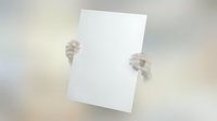 Hands holding blank white paper sheet against neutral background for mockup and presentation purposes.