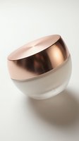 Luxury cosmetic jar with rose gold cap on neutral background for skincare and beauty product packaging design.