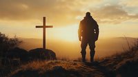 Silhouette of man standing near Christian cross at sunset, dramatic golden sky and mountain landscape creates spiritual atmosphere of faith and reflection.