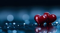 Red heart shapes reflecting on dark wet surface with bokeh lights in background, romantic mood setting for Valentine's Day or anniversary celebrations.