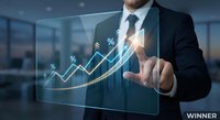 Professional businessman in dark suit touching holographic financial growth chart with percentage symbols and upward trending arrow in modern office environment.