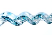 Clear blue water spiral wave flowing in twisted ribbon pattern on white background for refreshing design concepts.