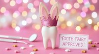 Tooth fairy concept with white tooth wearing pink glitter crown next to approval sign against bokeh lights background for dental care campaigns.