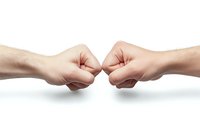 Two fists bumping together on white background showing friendship, unity, teamwork, agreement or greeting gesture between people isolated on clean backdrop.