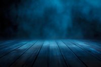 Empty wooden floor with dramatic blue foggy background and spotlight effect creates mysterious atmosphere for product display or presentation.