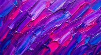Abstract purple and pink paint strokes creating dynamic textured background with vibrant magenta and blue colors for creative design projects.