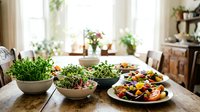 Fresh microgreens and colorful vegetable salads arranged on a rustic wooden dining table in a bright, plant-filled home interior setting.