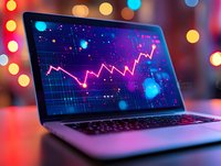Laptop screen displaying financial chart with glowing pink trend line against dark blue background, bokeh lights creating festive atmosphere for business concept.