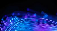 Abstract blue and purple flowing lines with bokeh lights creating dynamic wave patterns on dark background for modern digital design projects.