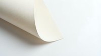 Rolled white paper sheet with curved edge on neutral background, suitable for stationery and office design projects.