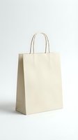 Empty beige paper shopping bag with handles isolated on white background for retail packaging and eco-friendly branding mockup designs.