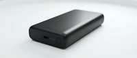 Portable black power bank with LED indicator lights isolated on white background, ready for product design, marketing materials, and tech illustrations.