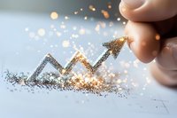 Glittering arrow graph trending upward with magical sparkle effect and bokeh lights on white surface, representing business growth and success in finance.