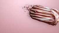 Creamy chocolate ice cream bar with melting texture and sprinkles on pastel pink background, ideal for summer dessert advertising.