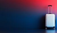 White hardshell wheeled suitcase on dark background with dramatic red and blue gradient lighting effect, minimal travel concept for luggage advertising.