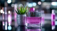 Glass cosmetic jar with pink moisturizer cream on reflective surface with succulent plant and blurred bokeh lights creating luxurious spa atmosphere.