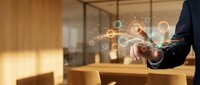 Businessman touching digital network interface with glowing connections in modern office environment for technology and business communication concepts.